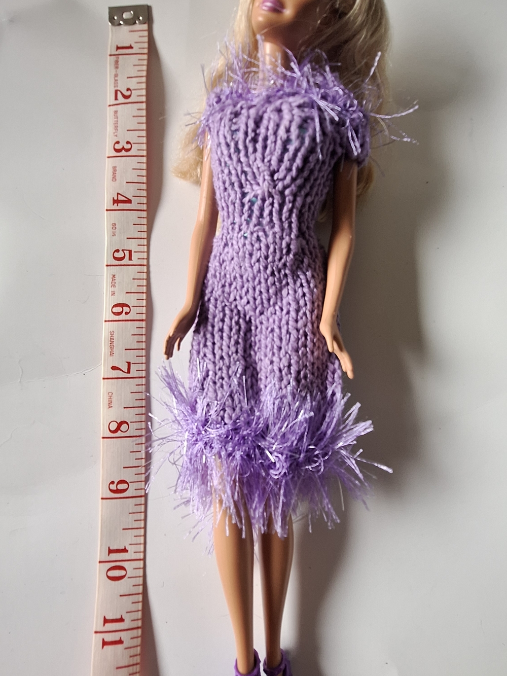 Barbie With Purple Knit Dress with Feather Trim